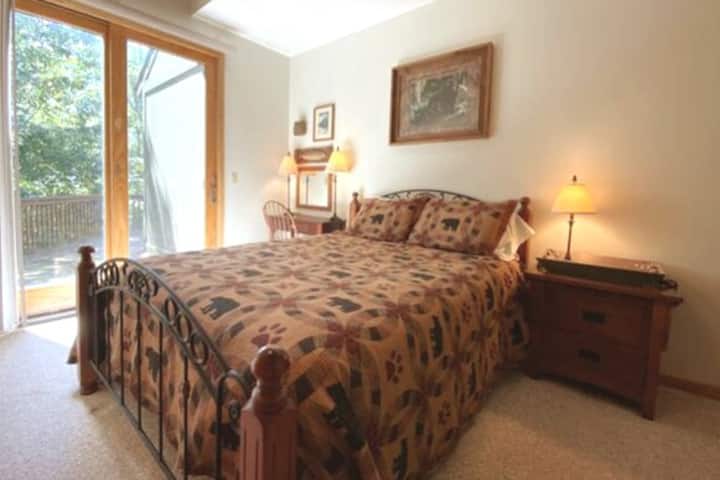 Super comfortable guest room with queen bed, dedicated work space, streaming TV and direct deck access 