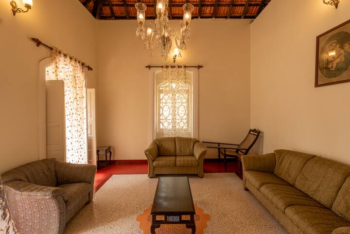 Living room with a pretty chandelier.