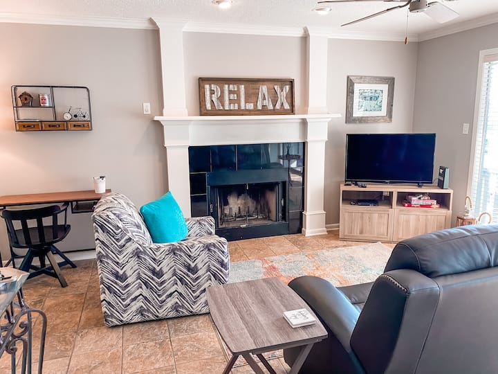 Relax in the living area in the double recliner with a lake view. 