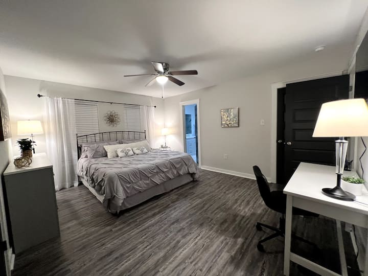 Master bedroom with king bed, en-suite bathroom, private work space. 