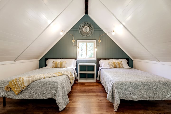 Take your pick of where to sleep… do you choose this boho-chic loft bedroom?  It boasts two full beds, a bench to put your bags on and a cozy hangout lounge with kid-friendly games and an app-enabled TV.  Oh, and enjoy comfy new foam mattresses too!