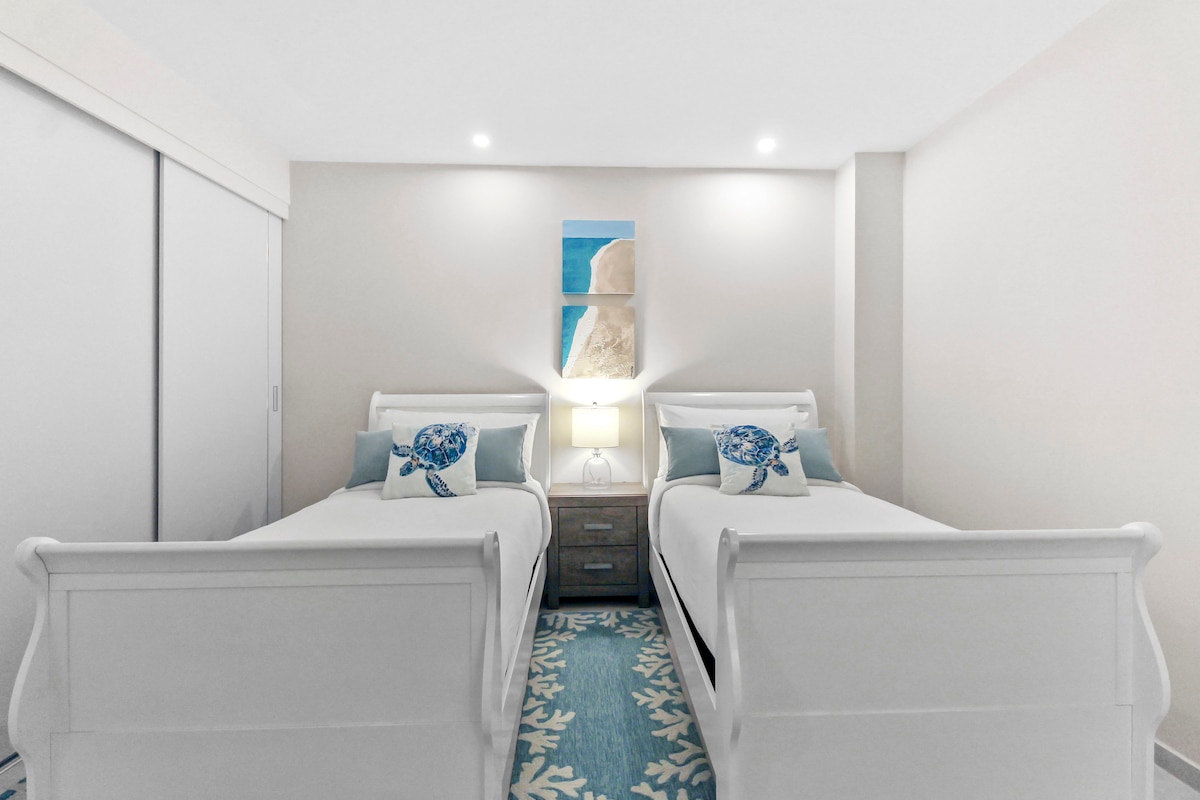 Bedroom 2 | High-quality linens, bedding, and plenty of cushions are provided for a relaxing vacation.