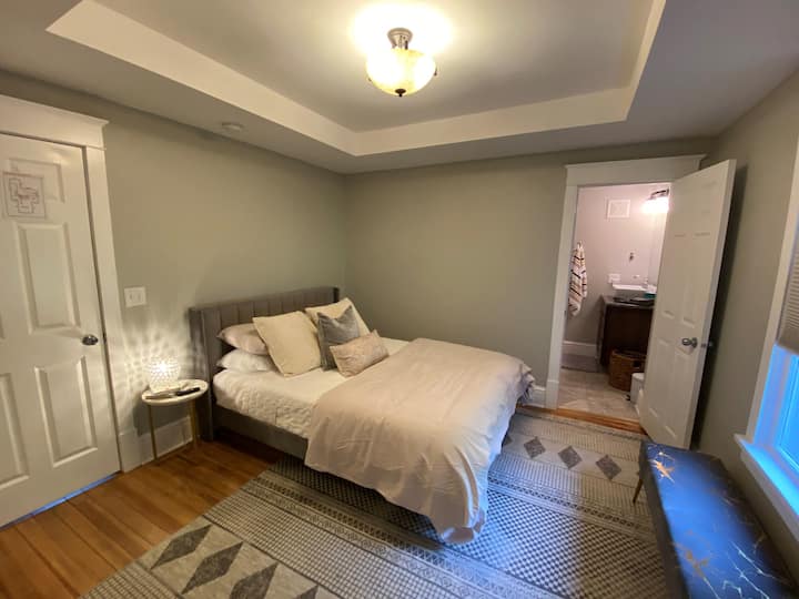 Comfortable Queen bed with attached full bathroom on the main floor.