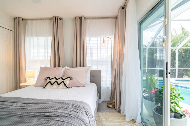 Bedroom 2.  Queen-sized bed, with lakefront views and direct pool access.