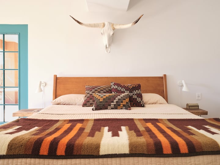 The main suite in the home is great place to get some rest after a day out adventuring.  Dream away on the king sized solid wood bed frame and Casper mattress. 