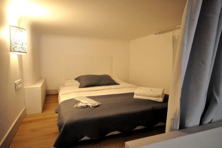 This loft sleeping place is accessible by stairs from the ground floor living area. It is low-ceilinged.