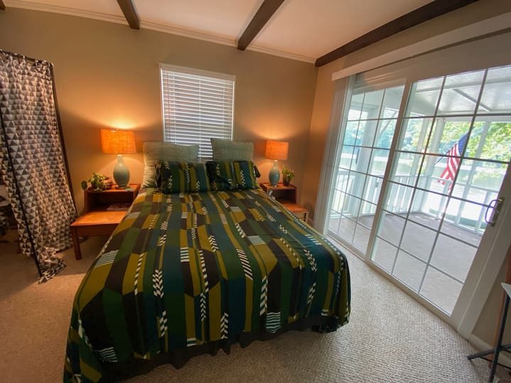 Northside bedroom with queen bed and porch access.  Good luck getting out of bed with these spectacular views!