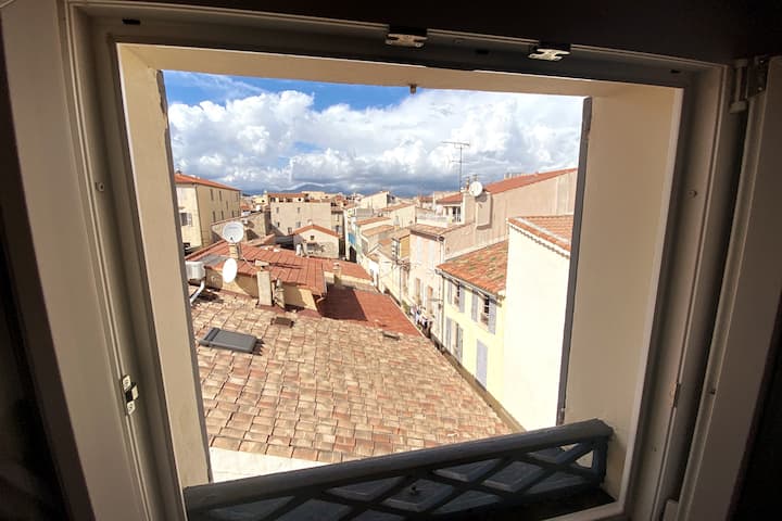 Bedroom 2 view of rooftops and mountains. 