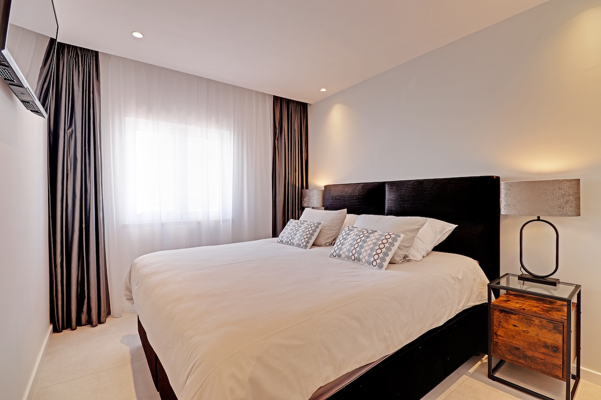 Master bedroom with luxury divan bed, built in wardrobe, TV and Aircon