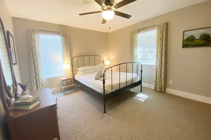 Bedroom #2 offers a wrought iron queen bed with tuft&needle memory foam mattress and an antique vintage dresser.