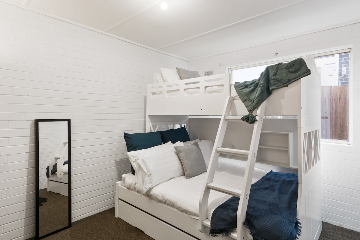 The family-friendly third bedroom is located downstairs and comes with a combination bunk bed.
