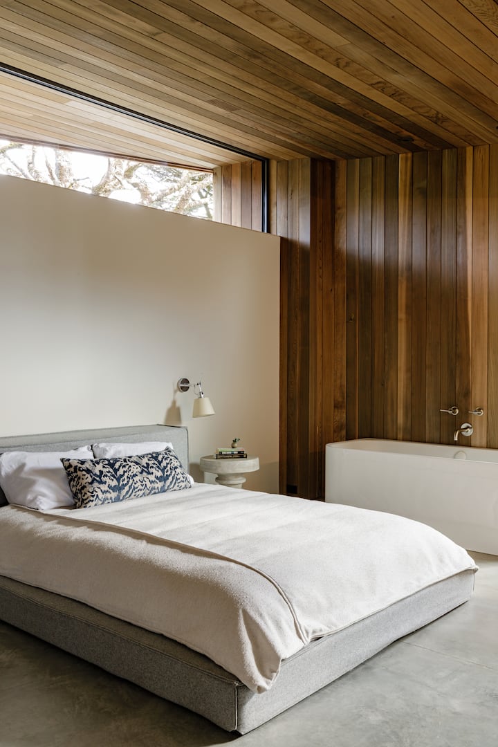 Front bedroom with queen size bed plus bathroom including shower and large soaking tub.
