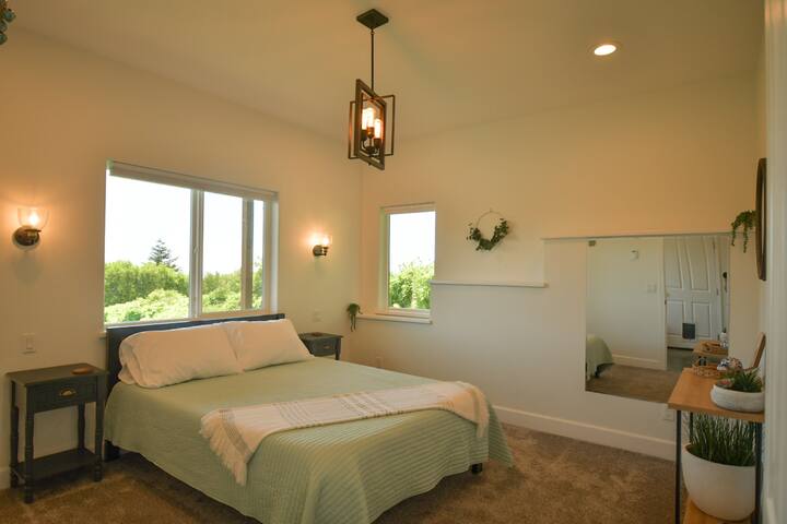 Primary bedroom with queen size bed and private walk-in-closet and restroom attached