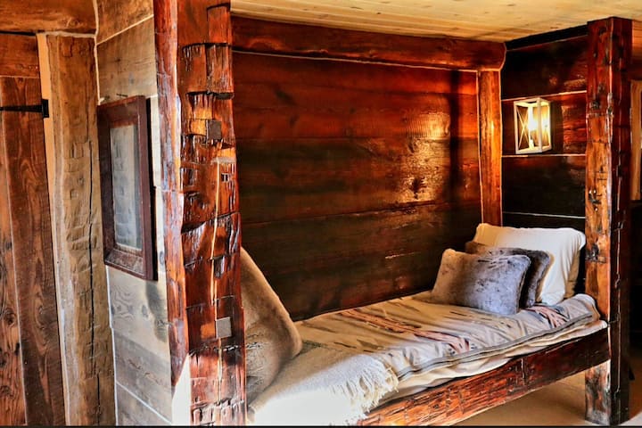 Cozy built-in bed made from hand hewn PA barn beams from the early 1800's- custom size, a bit longer than twin xl. Memory foam mattress. The trundle bed is stored underneath for an additional guest.