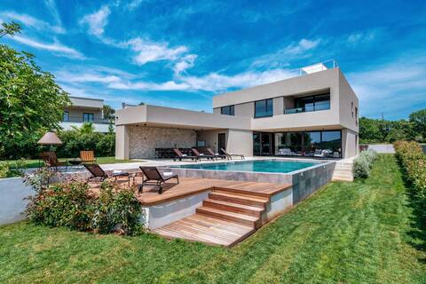 Luxury beachside villa with a pool and a sea view