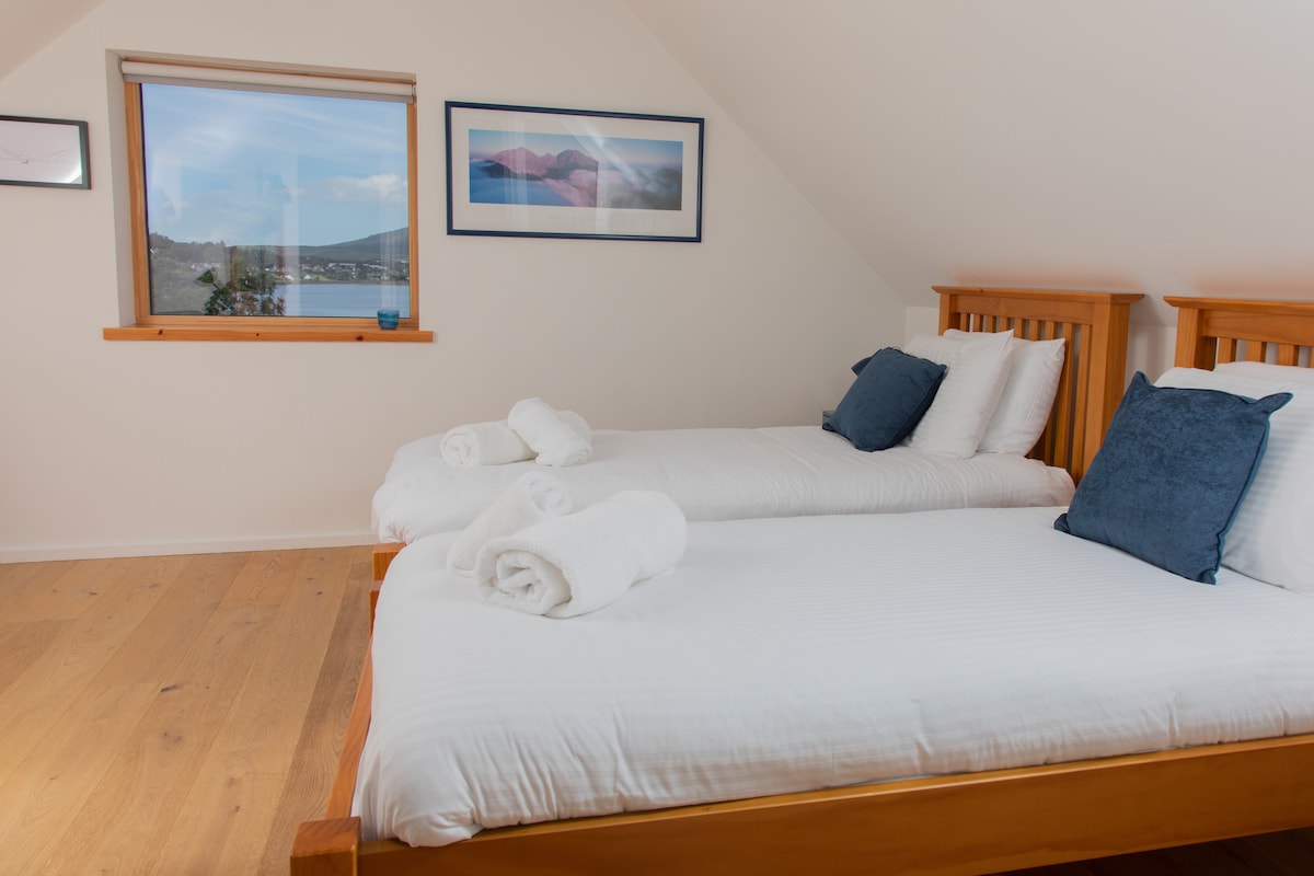 Dual aspect views and plenty of space in the first floor twin bedroom. 