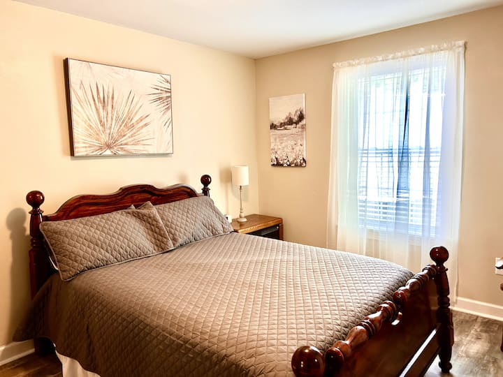 First floor bedroom with Queen bed and Smart TV.
