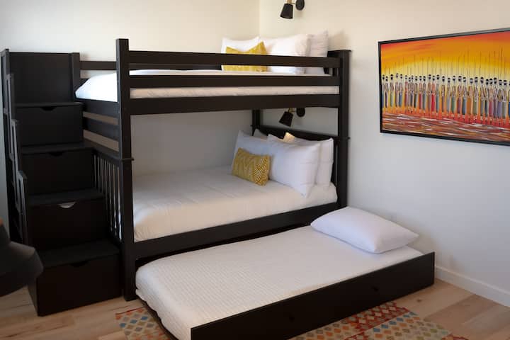 Bunk room with two full beds and one twin trundle
