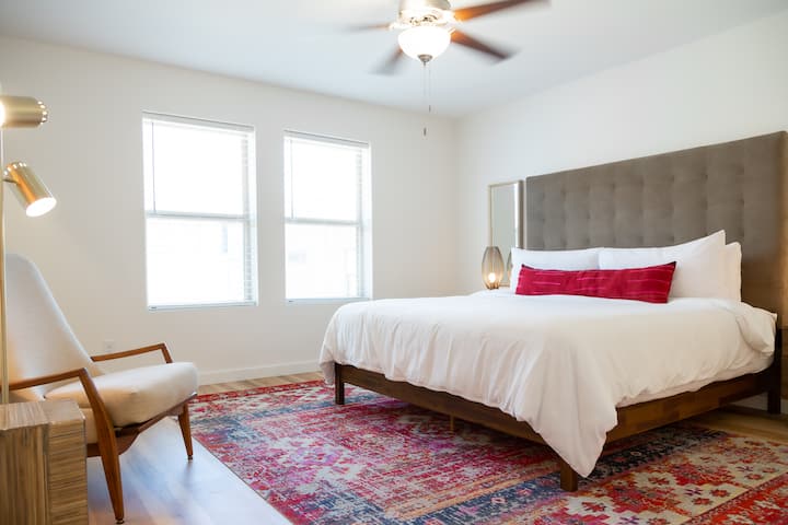 Primary bedroom with a king bed and a walk-in closet