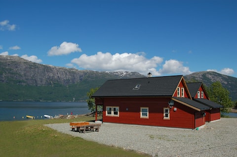 Great house on the beach edge of the Hardangerfjord