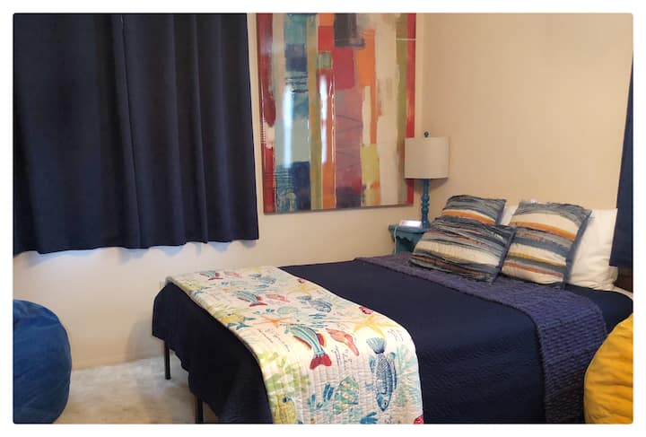 Queen bed, one full bed under the twin bunk beds in this guest room. Great room for all the campers to get some shut eye.