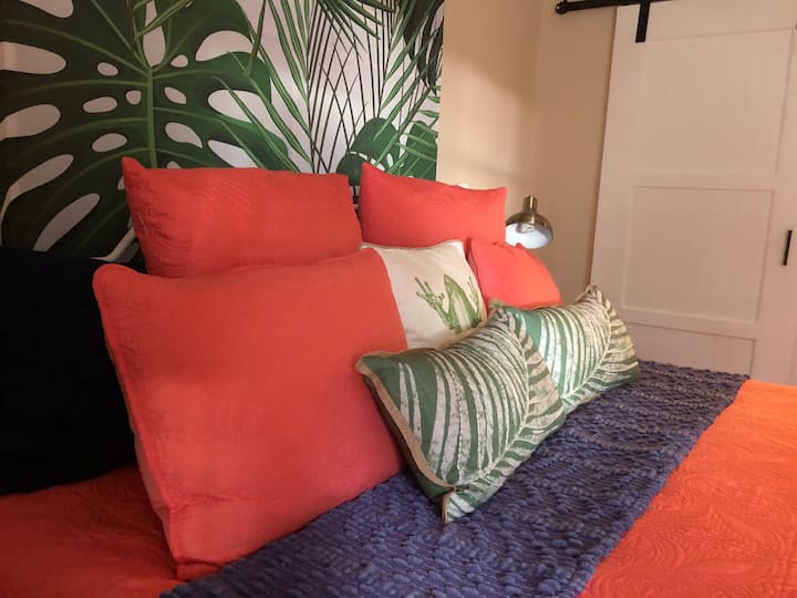 Big King Bed ready for relaxation in this bedroom with a garden view.
