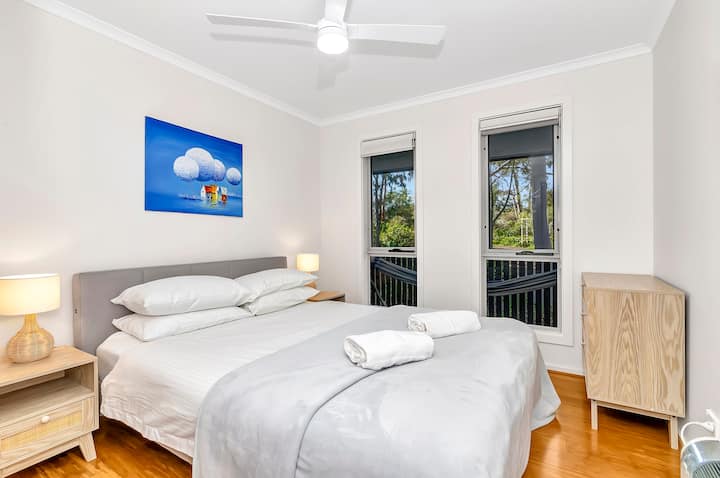  The second bedroom is immaculately presented with a queen-sized bed and ceiling fan to keep you comfortable.