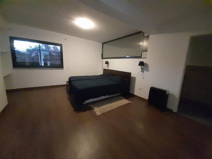 Suite #6 with private bathroom and two single beds