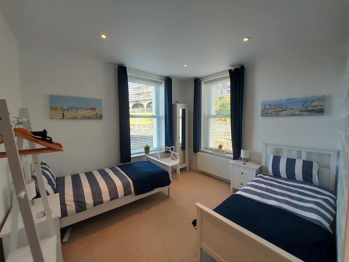 A seaside themed twin room. A bed guard is available for the smaller guests.