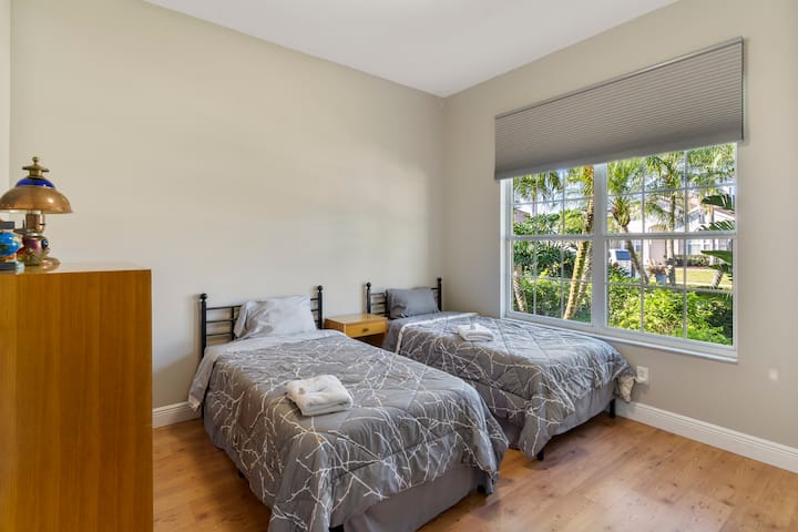 Guest bedroom with two twin beds.