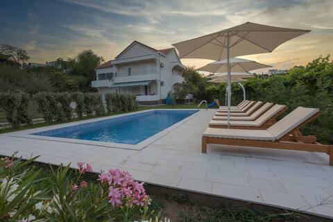 Captivating 4BD Villa with Outdoor Pool and Garden