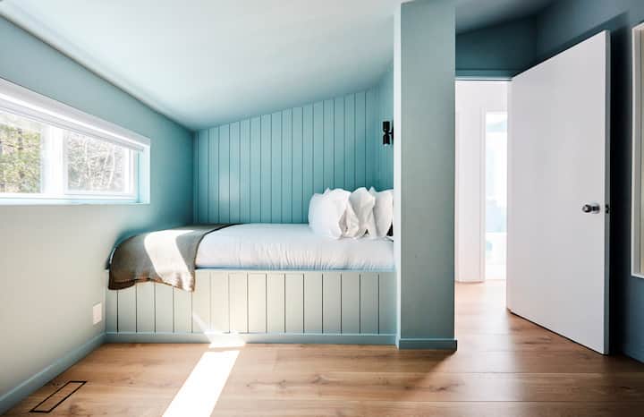 Our adorable cozy built-in QUEEN bedroom. Perfect for both adults + kids. Full bathroom directly outside room.