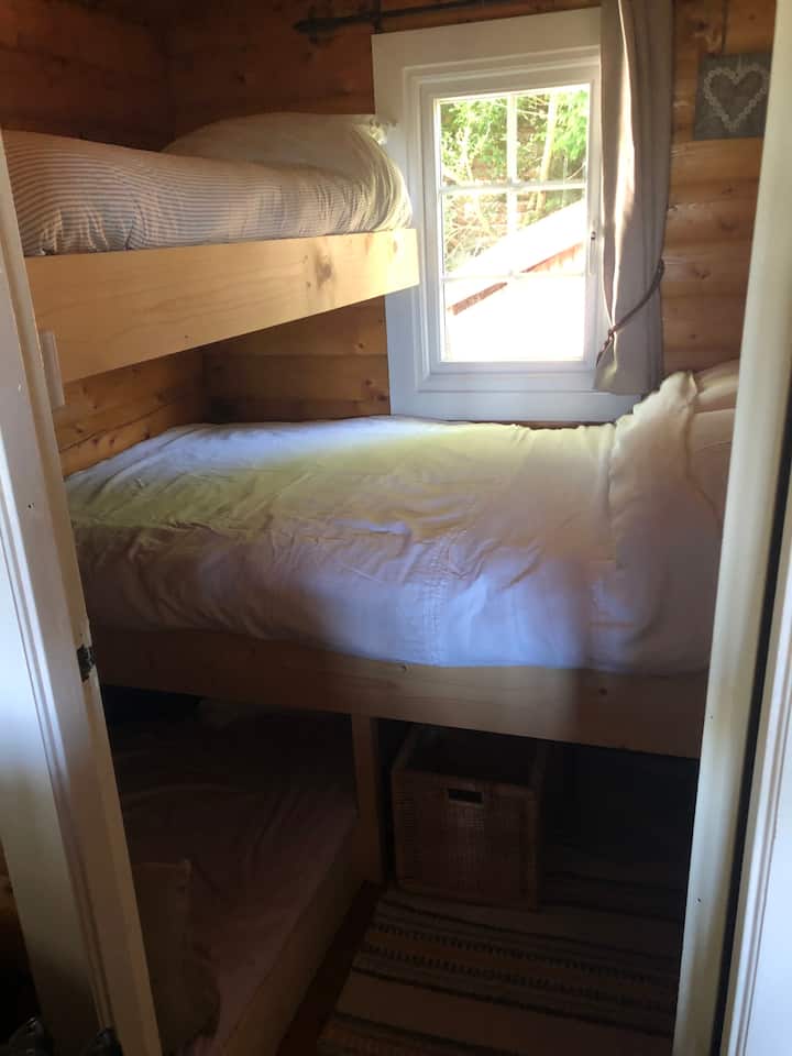 Second bedroom with a double bed and single over.  Please note, no ladders (access if from the double bed,  please assess if this  access is safe for smaller children.  We do offer a removable safety rail for the top bunk.
