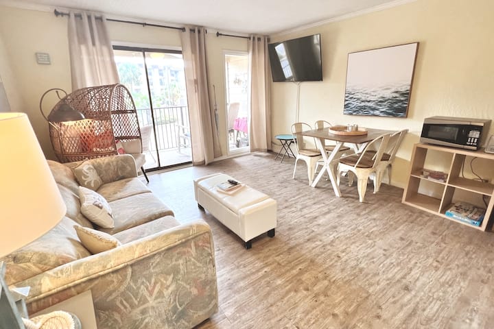 You'll find an open and airy living space with plenty of seating.  The sliders lead to a fabulous balcony....