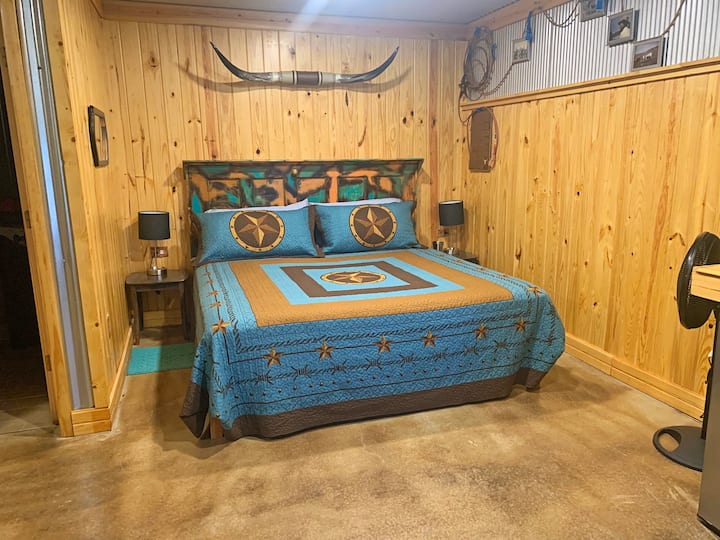 relax after a day of hiking in the king sized bed in the Saving the Longhorn Cabin at The Lazy Buffalo, Cache, Oklahoma