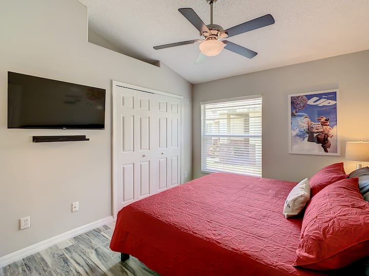 King bedroom inspired by Pixar’s Up, complete with a private bathroom featuring a shower and tub combo.