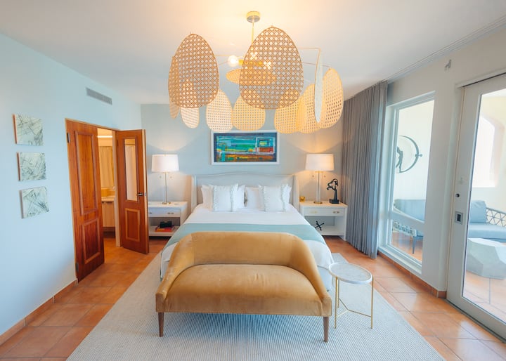 Bedroom 1 - Master: King size bed, Ensuite bathroom, Dual vanity, Walk-in closet, Television, Air conditioning, Ceiling fan, Direct access to the balcony area.
