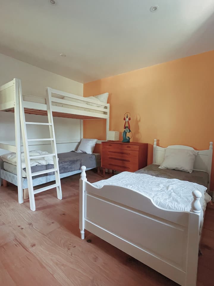 A perfect room to accommodate 3 children, with 3 90 beds including 1 bunk. If needed, the two beds downstairs can be pushed together to accommodate a couple