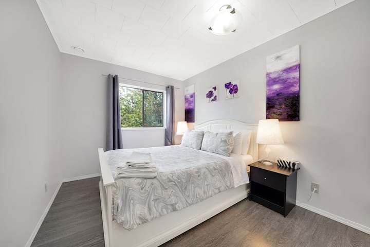 The second bedroom with queen bed and a spacious closet.