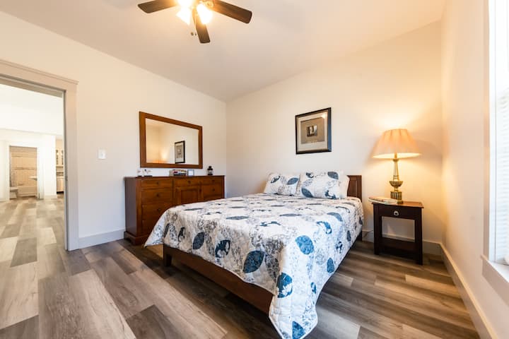 The first-floor queen bedroom conveniently sits off the living room.