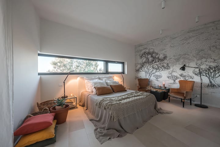 Bedroom #1: double bed, view on pool, olive trees and sea. Private bathroom .