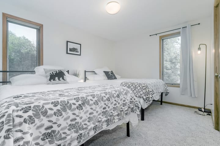 2nd floor bedroom - 2 full beds and a closet.  Windows provide more views of the bluffs