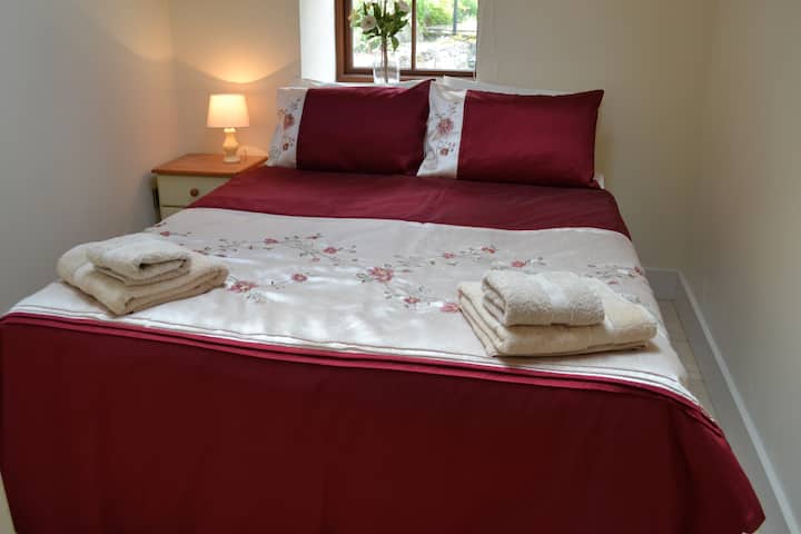 Room 2  lower floor. Kingsize bed or 2 singles on request.  Med to firm mattress