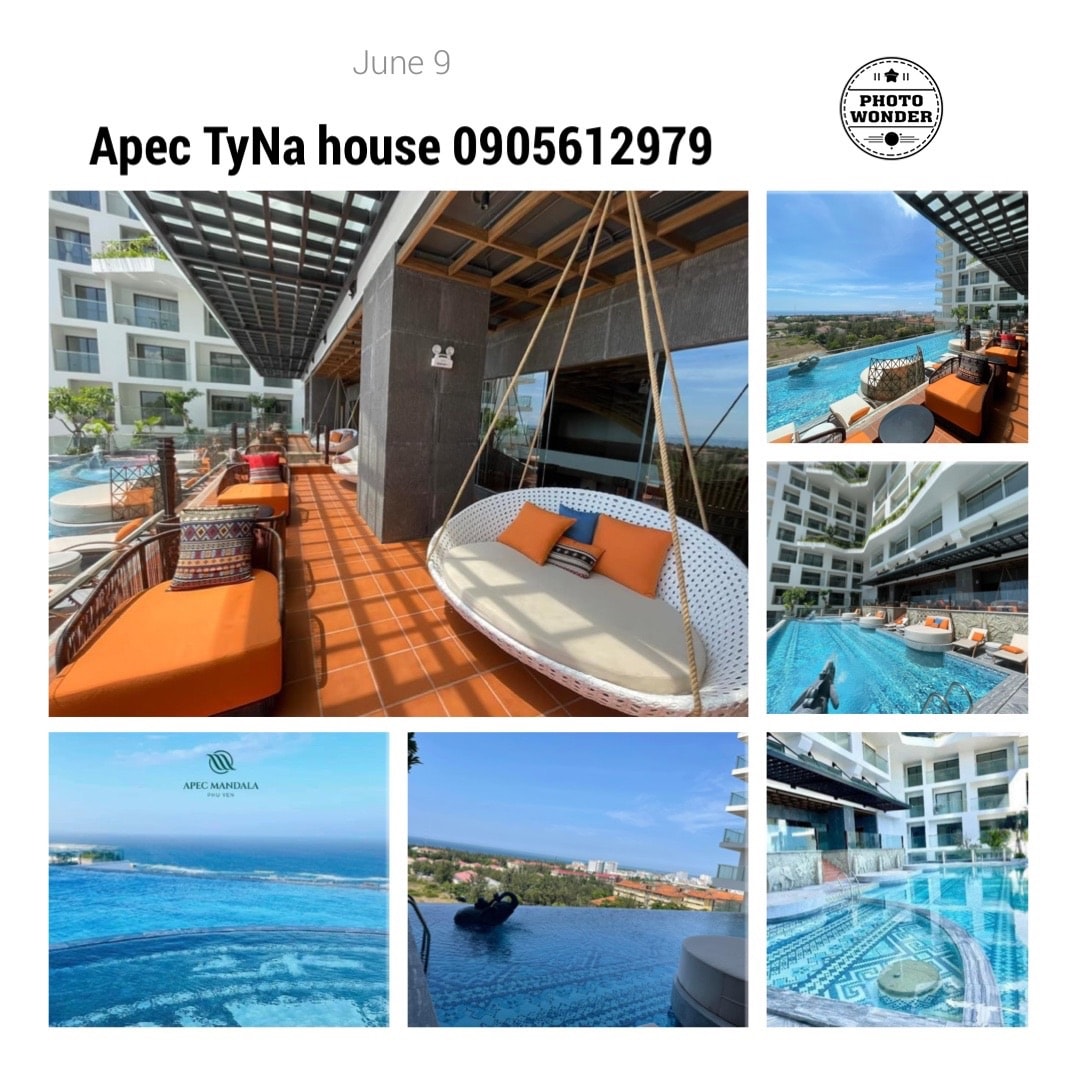 A relaxing outdoor space features a hanging chair, surrounded by comfortable seating options. A view of the pool is visible, alongside the lush greenery and distant ocean. The bright tiles and open design contribute to a welcoming atmosphere.