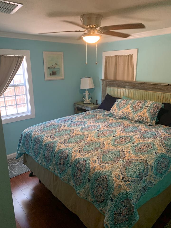 1st bedroom with King bed, night stands on each side, closet with hangers and storage, 2 windows. Very comfortable! :)