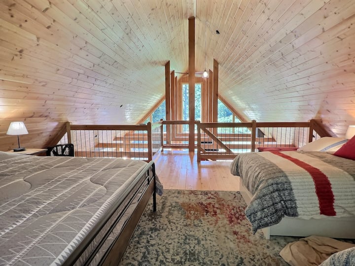 Loft with king bed and two twin beds.