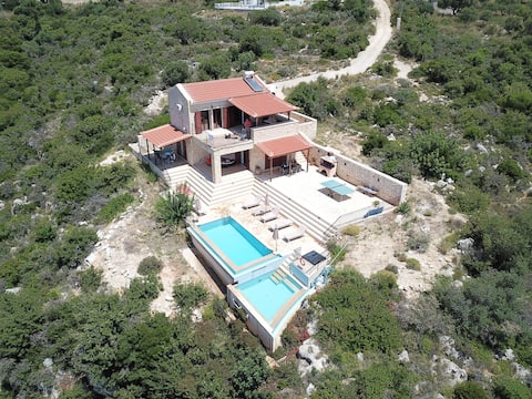Beautiful villa 2 pools stunning views above beach
