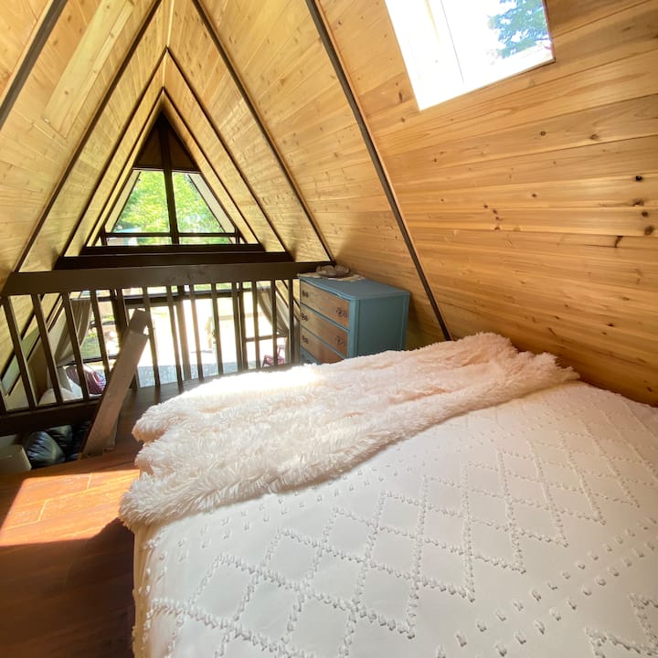 The loft features a queen-sized mattress and views of the canopy.