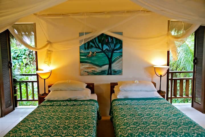 The third bedroom, upstairs is fan-cooled and is airy and  naturally ventilated.