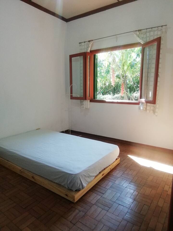 Room 1 with a double bed 